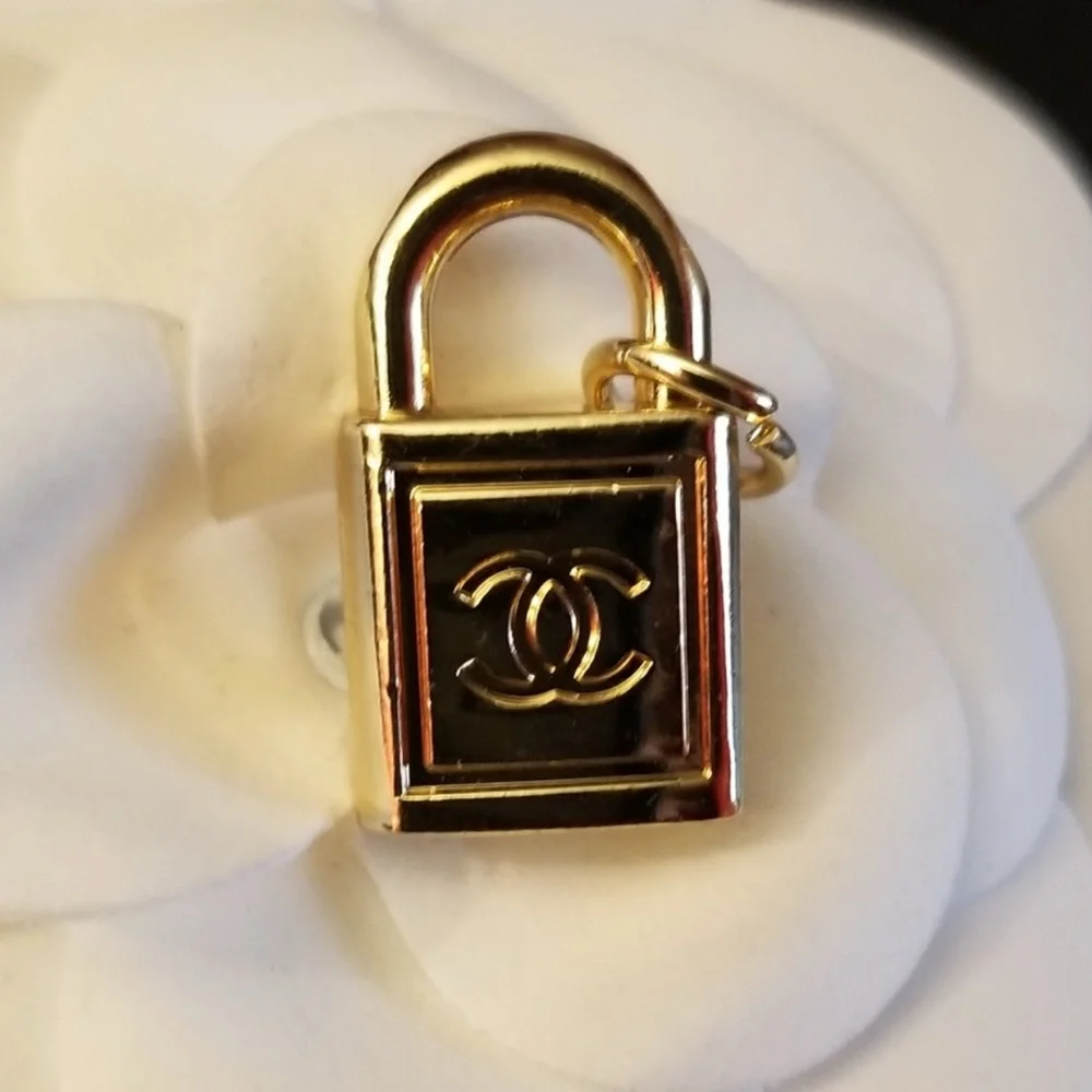 CHANEL- Gold Padlock Charm Pendant with CC Logo